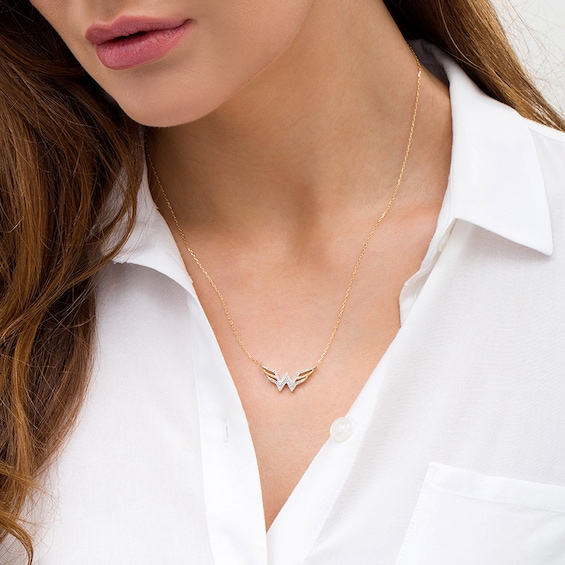 Previously Owned - Wonder Woman™ Collection 1/8 CT. T.w. Diamond Symbol Necklace in 10K Gold