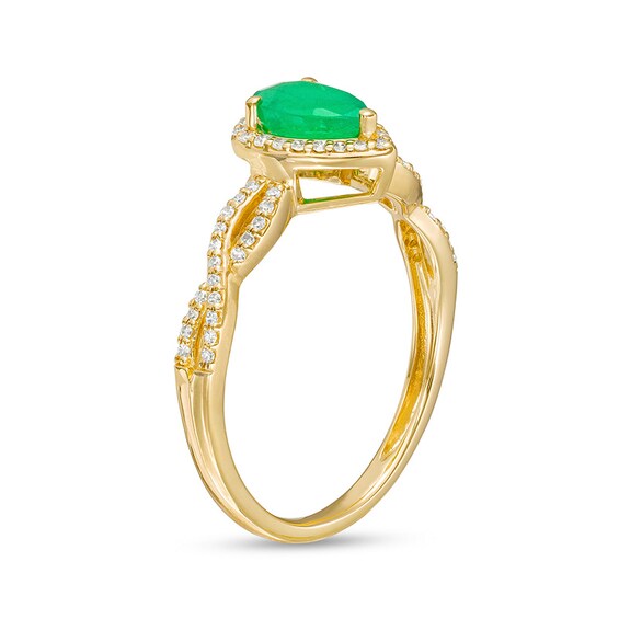 Previously Owned - Pear-Shaped Emerald and 1/6 CT. T.w. Diamond Frame Twist Shank Ring in 10K Gold