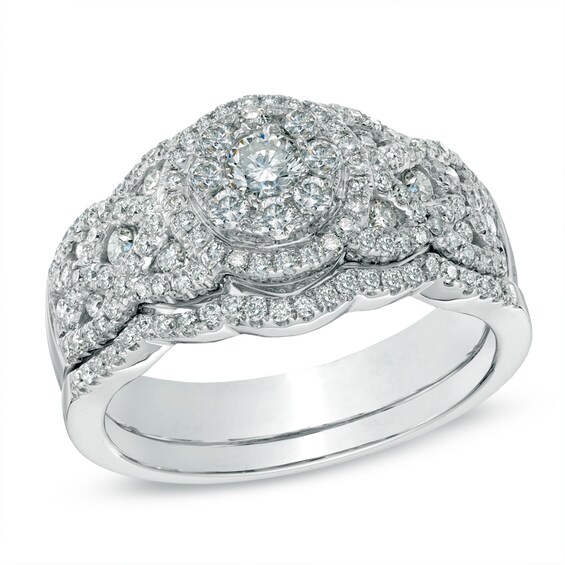Previously Owned - 1 CT. T.w. Multi-Diamond Twisting Bridal Set in 14K White Gold