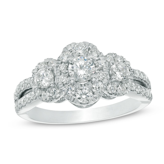 Previously Owned - 1-1/4 CT. T.w. Diamond Oval Frame Three Stone Engagement Ring in 10K White Gold