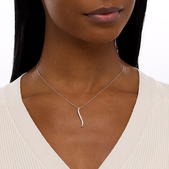 Previously Owned - Serena Williams jewelry 1/4 CT. T.w. Diamond Graduated Curved Drop Pendant in 10K White Gold
