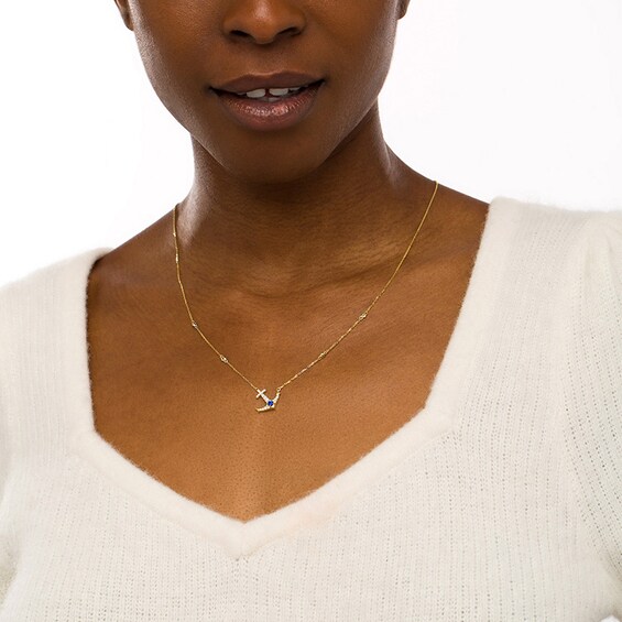 Previously Owned - Blue Sapphire and 1/4 CT. T.w. Diamond Offset Anchor Necklace in 10K Gold