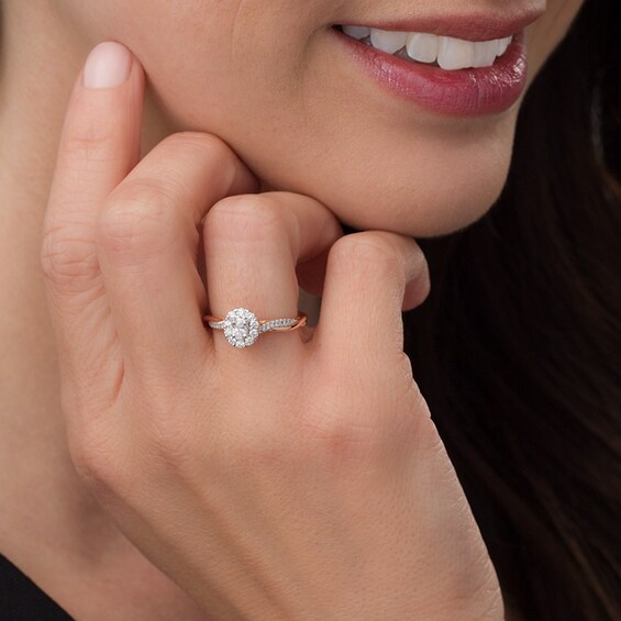 Previously Owned - 3/8 CT. T.w. Oval Diamond Frame Twist Engagement Ring in 10K Rose Gold