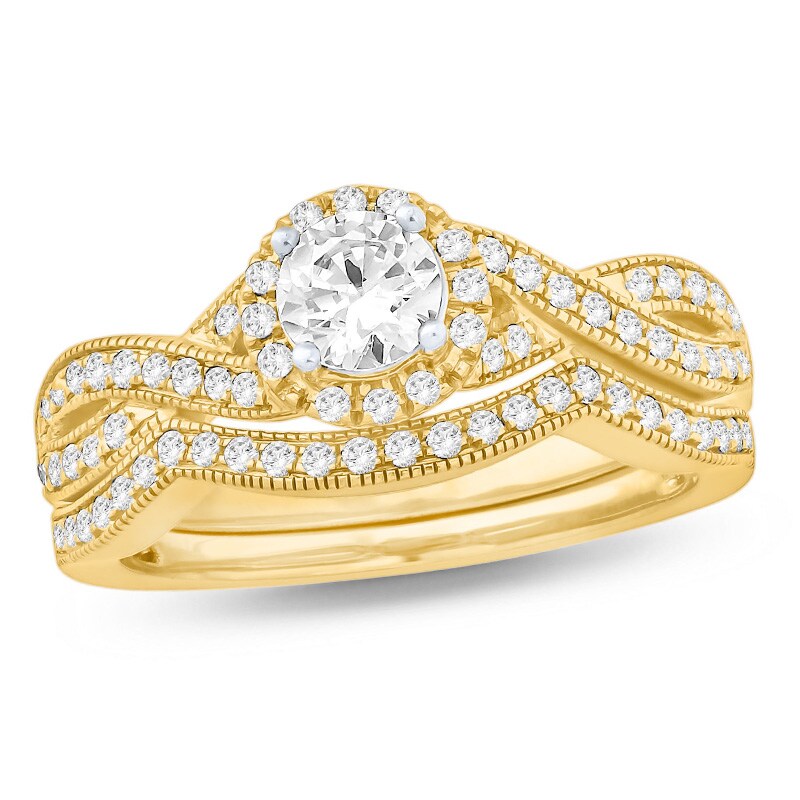 Main Image 1 of Previously Owned - 3/4 CT. T.W. Diamond Twist Shank Bridal Set in 14K Gold