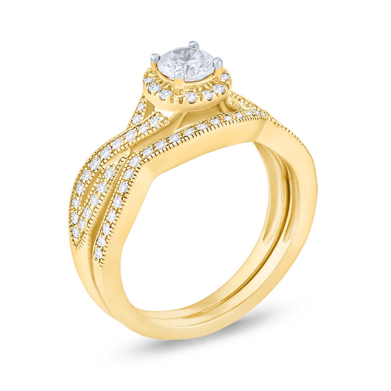 Main Image 2 of Previously Owned - 3/4 CT. T.W. Diamond Twist Shank Bridal Set in 14K Gold