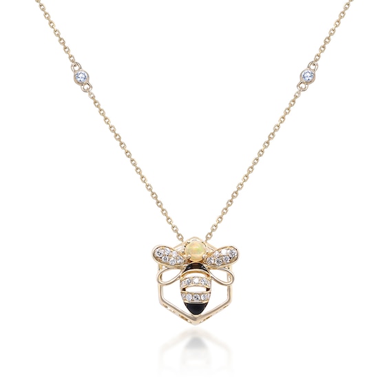 Previously Owned - 3.5mm Opal and 1/5 CT. T.w. Diamond Black Enamel Bee and Honeycomb Outline Pendant in 10K Gold