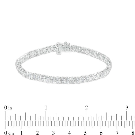 Previously Owned - 1 CT. T.w. Diamond Alternating "Xo" Line Bracelet in 10K White Gold – 7.25"