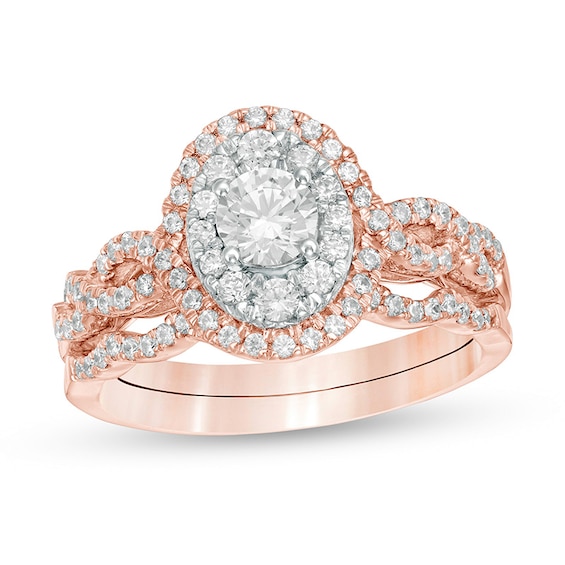 Previously Owned - 1 CT. T.w. Diamond Double Oval Frame Twist Shank Bridal Set in 10K Rose Gold