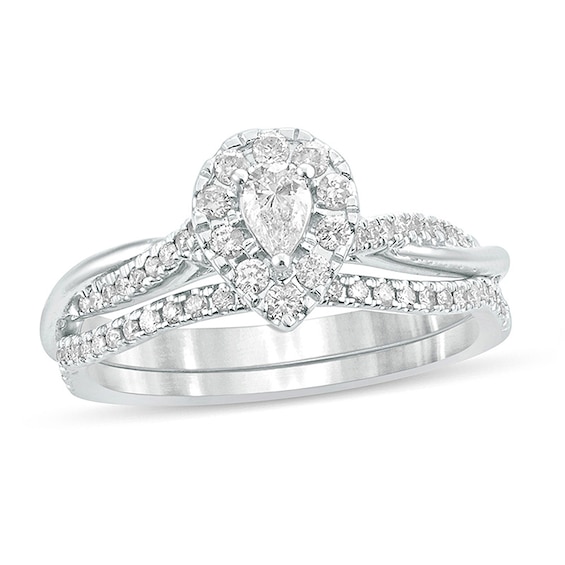 Previously Owned - 1/2 CT. T.w. Pear-Shaped Diamond Frame Twist Shank Bridal Set in 10K White Gold