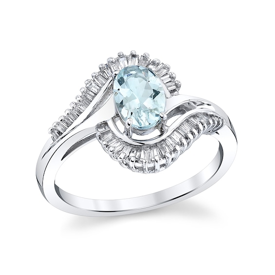 Previously Owned - Oval Aquamarine and 1/3 CT. T.w. Baguette Diamond Frame Bypass Ring in 14K White Gold