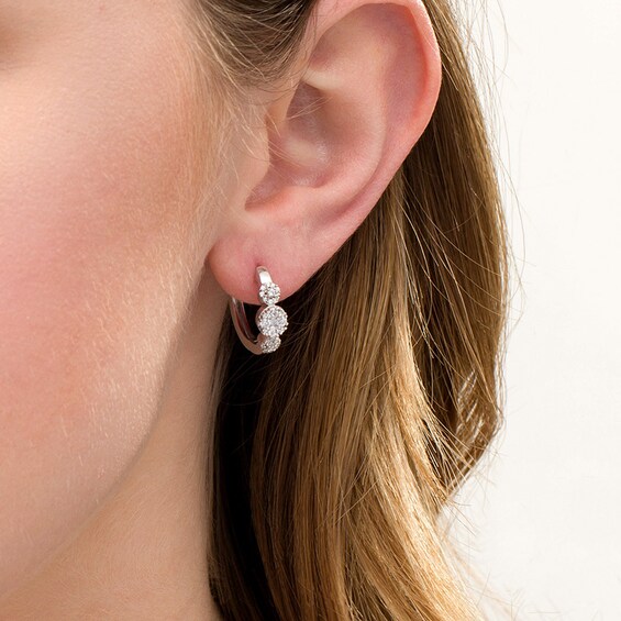 Previously Owned - 1/2 CT. T.w. Multi-Diamond Diamond Three Stone Hoop Earrings in 10K White Gold
