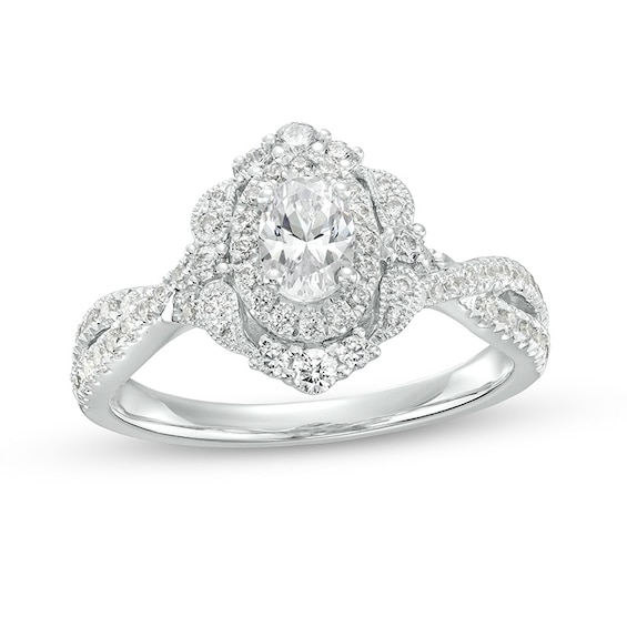 Previously Owned - 1 CT. T.w. Oval Diamond Double Frame Twist Shank Paisley Engagement Ring in 14K White Gold (I/I2)
