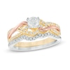 Thumbnail Image 1 of Previously Owned - 1/2 CT. T.W. Diamond Twist Bridal Set in 10K Tri-Tone Gold