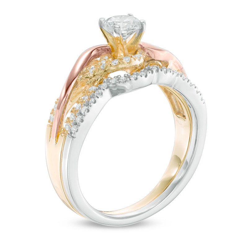 Main Image 2 of Previously Owned - 1/2 CT. T.W. Diamond Twist Bridal Set in 10K Tri-Tone Gold
