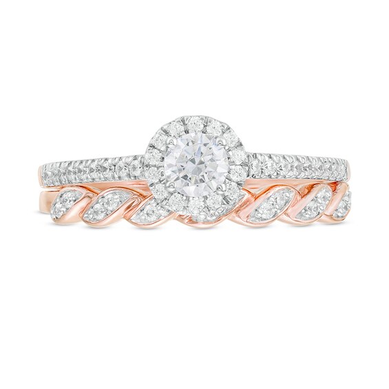 Previously Owned - 1/2 CT. T.w. Diamond Frame Twist Shank Bridal Set in 10K Rose Gold