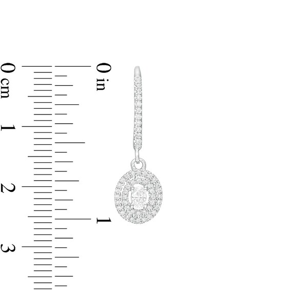 Previously Owned - 1/2 C. T.w. Oval Diamond Double Frame Drop Earrings in 10K White Gold