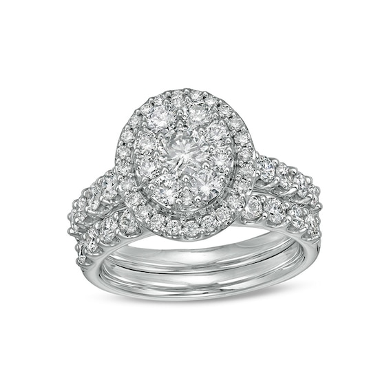 Previously Owned - 2 CT. T.w. Multi-Diamond Oval Diamond Frame Bridal Set in 14K White Gold