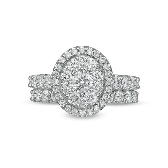 Previously Owned - 2 CT. T.w. Multi-Diamond Oval Diamond Frame Bridal Set in 14K White Gold