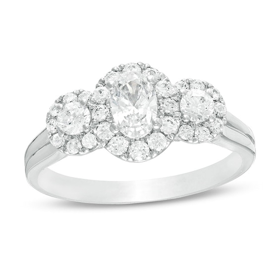 Previously Owned - Celebration Ideal 1 CT. T.w. Oval Diamond Frame Three Stone Engagement Ring in 14K White Gold (I/I1)