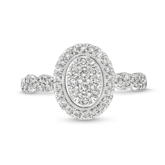 Previously Owned - 1/2 CT. T.w. Oval Multi-Diamond Frame Twist Shank Engagement Ring in 10K White Gold