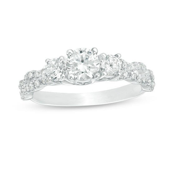 Previously Owned - 1 CT. T.w. Diamond Three Stone Braid Engagement Rink in 10K White Gold