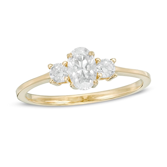 Previously Owned - 5/8 CT. T.w. Oval and Round Diamond Three Stone Engagement Ring in 14K Gold