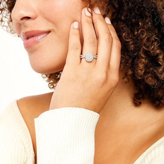 Previously Owned - 3/4 CT. T.w. Pear Multi-Diamond Frame Twist Split Shank Engagement Ring in 10K White Gold