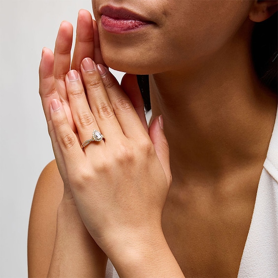 Previously Owned - 1 CT. T.w. Pear-Shaped Lab-Grown Diamond Frame Crossover Shank Engagement Ring in 14K Gold (F/Si2)