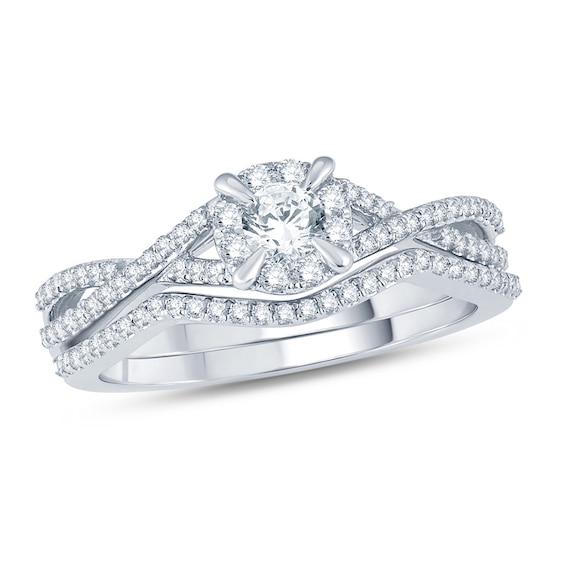 Previously Owned - 1/2 CT. T.w. Diamond Frame Twist Bridal Set in 14K White Gold