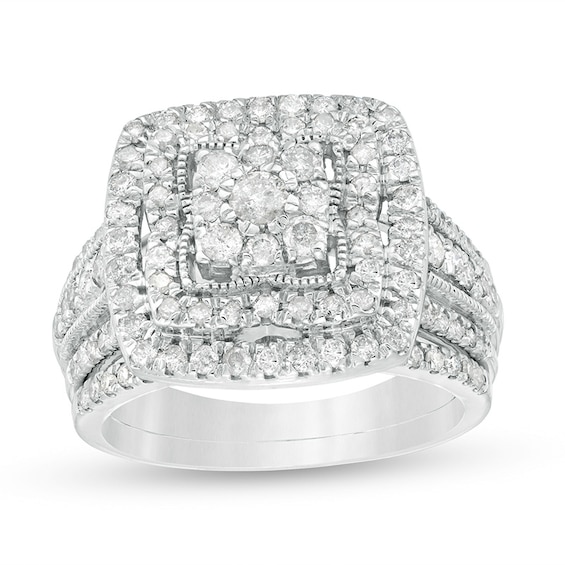Previously Owned - 1-1/3 CT. T.w. Multi-Diamond Cushion Frame Multi-Row Bridal Set in 10K White Gold