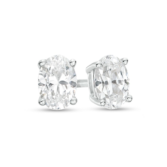 Previously Owned - 1/2 CT. T.w. Oval Lab-Grown Diamond Solitaire Stud Earrings in 14K White Gold (F/Si2)
