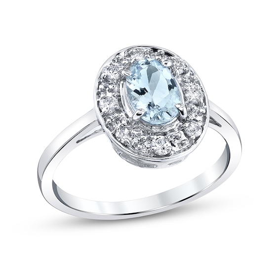 Previously Owned - Oval Aquamarine and 1/5 CT. T.w. Diamond Frame Ring in 14K White Gold