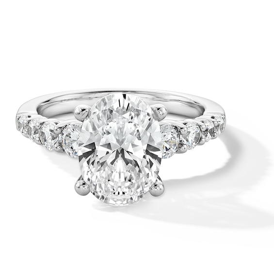 Previously Owned - 3-3/4 CT. T.w. Oval Lab-Grown Diamond Graduated Shank Engagement Ring in 14K White Gold (I/Si2)