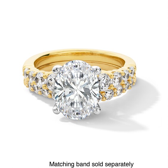 Previously Owned - 3-3/4 CT. T.w. Oval Lab-Grown Diamond Graduated Shank Engagement Ring in 14K Gold (I/Si2)