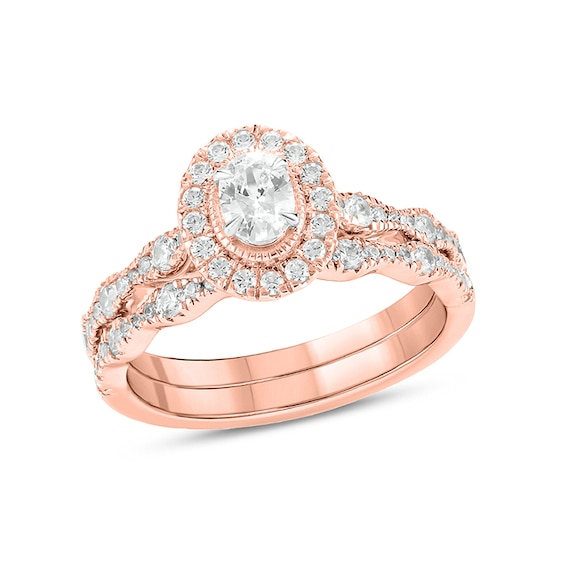 Previously Owned - 1 CT. T.w. Oval Diamond Frame Vintage-Style Bridal Set in 14K Rose Gold