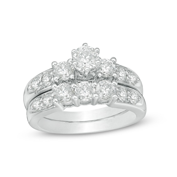 Previously Owned - 2 CT. T.w. Diamond Three Stone Soldered Bridal Set in 14K White Gold