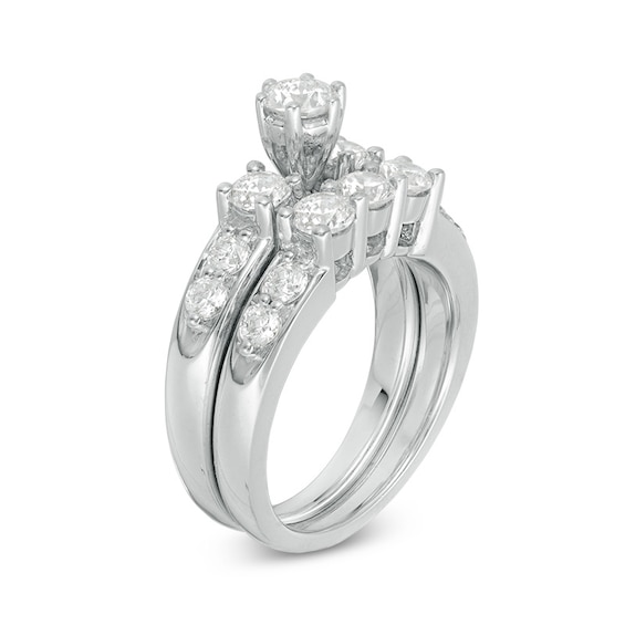 Previously Owned - 2 CT. T.w. Diamond Three Stone Soldered Bridal Set in 14K White Gold