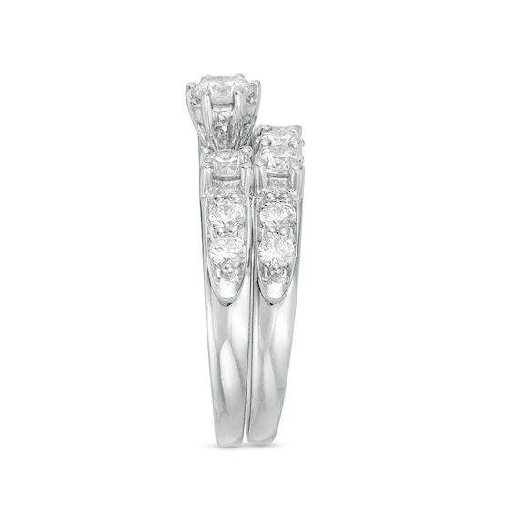 Previously Owned - 2 CT. T.w. Diamond Three Stone Soldered Bridal Set in 14K White Gold