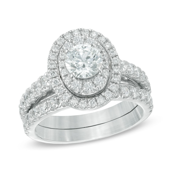 Previously Owned - 2 CT. T.w. Diamond Oval Frame Soldered Bridal Set in 14K White Gold