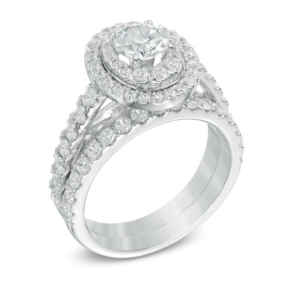 Previously Owned - 2 CT. T.w. Diamond Oval Frame Soldered Bridal Set in 14K White Gold