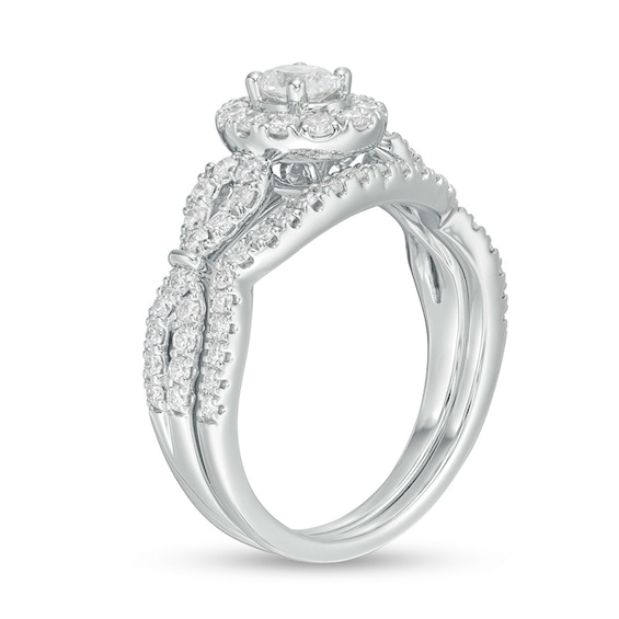 Previously Owned - 1 CT. T.w. Oval Diamond Frame Collar Soldered Bridal Set in 14K White Gold (I/I2)