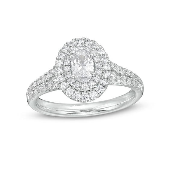 Previously Owned - 1 CT. T.w. Oval Diamond Double Frame Engagement Ring in Platinum (I/Si2)