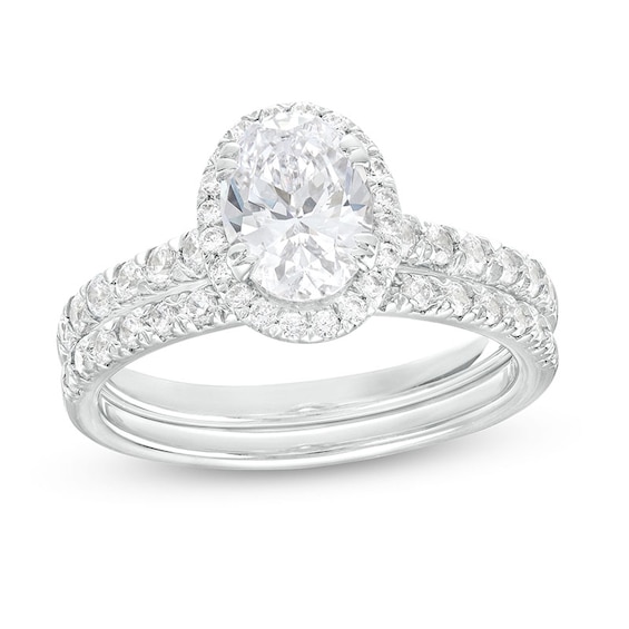 Previously Owned - 1-3/4 CT. T.w. Oval Lab-Grown Diamond Frame Bridal Set in 14K White Gold (I/Si2)