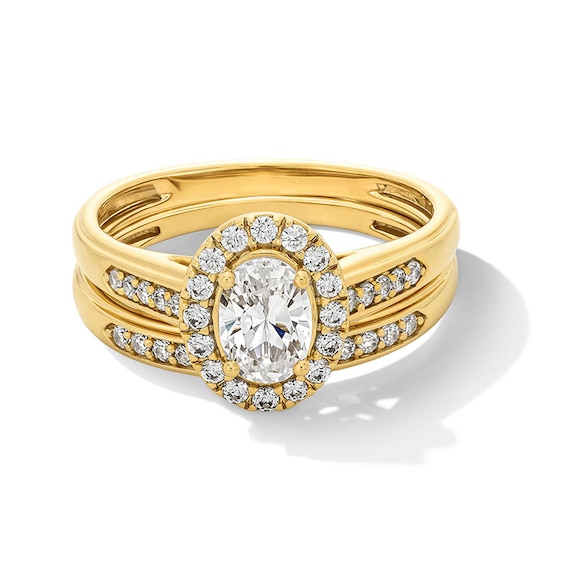 Previously Owned - 1 CT. T.w. Oval Lab-Grown Diamond Frame Wedding Ensemble in 10K Gold (F/Si2) - Size 7 and 10