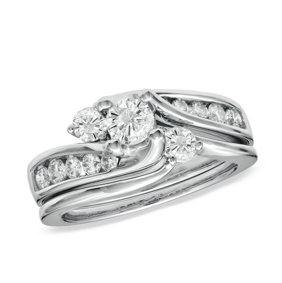 Previously Owned - 1 CT. T.w. Diamond Three Stone Swirl Soldered Bridal Set in 14K White Gold