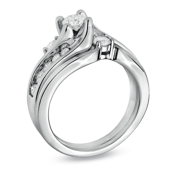 Previously Owned - 1 CT. T.w. Diamond Three Stone Swirl Soldered Bridal Set in 14K White Gold