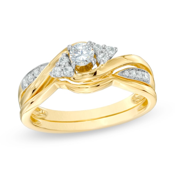 Previously Owned - 1/3 CT. T.w. Diamond Twist Shank Soldered Bridal Set in 10K Gold