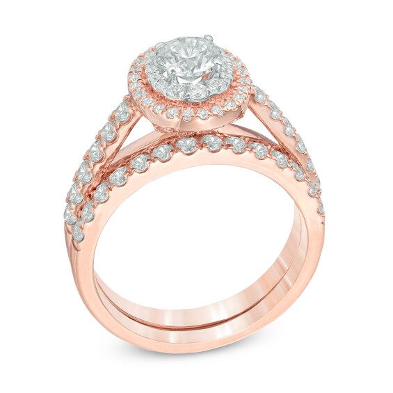 Previously Owned - 1-1/2 CT. T.w. Diamond Oval Double Frame Soldered Bridal Set in 14K Rose Gold