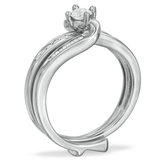 Previously Owned - 1/2 CT. T.w. Round and Baguette Diamond Wave Soldered Bridal Set in 10K White Gold