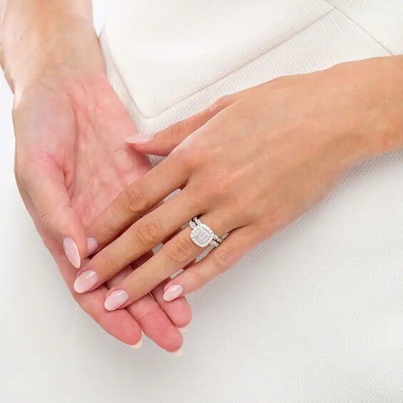 Previously Owned - 1 CT. T.w. Quad Princess-Cut Diamond Cushion-Shaped Frame Twist Soldered Bridal Set in 14K White Gold